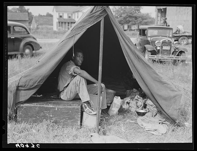 Migrant laborers from Florida in their tent next to the grading station in Belcross, N.C., 1940. Photo by Jack Delano. Courtesy, Library of Congress

