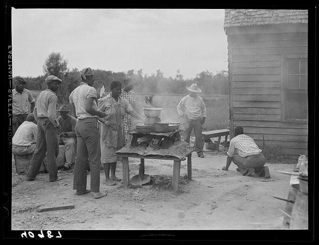 Outdoor kitchen for a labor camp in Old Trap, N.C. Approx. 35 men and women stayed at the camp during the potato harvest. Photo by Jack Delano. Courtesy, Library of Congress

