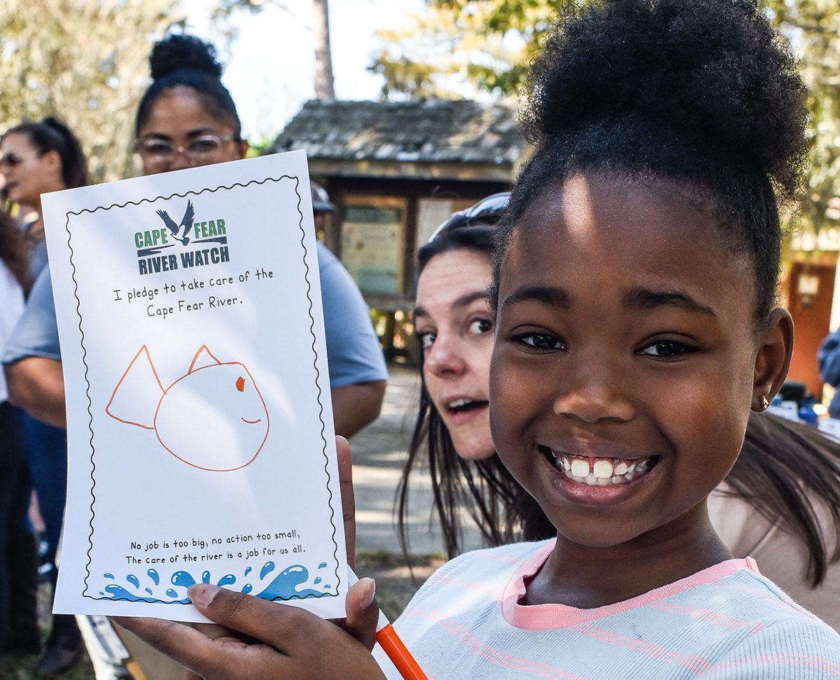 Attendees take part in an educational activity at a previous LakeFest. Photo: Alan Cradick/Cape Fear River Watch