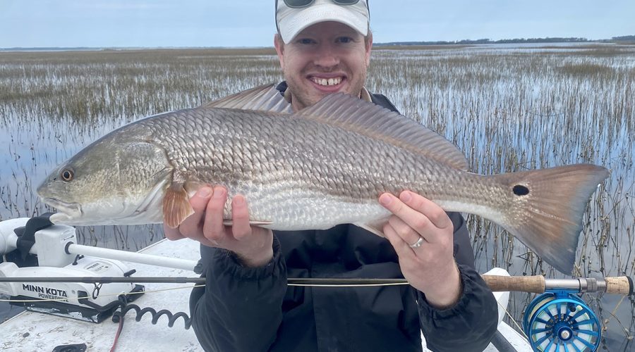 Evan Dintaman of Virginia shows off a lovely redfish caught during the last days of October. Photo: Gordon Churchill
