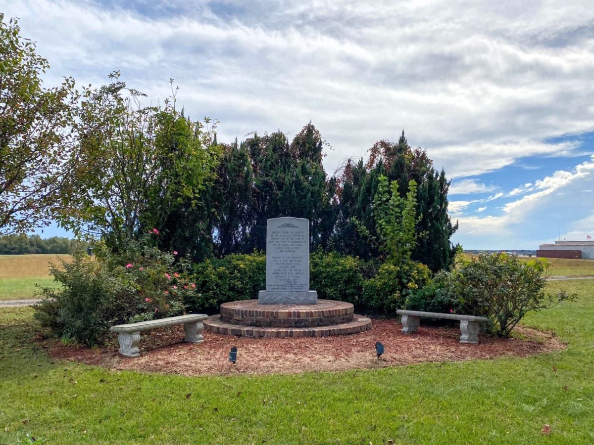 The memorial at Far Cemetery was erected in 2003 to honor of the formerly enslaved and free people who were buried there from 1862 to 1930. Photo contributed by James City Historical Society