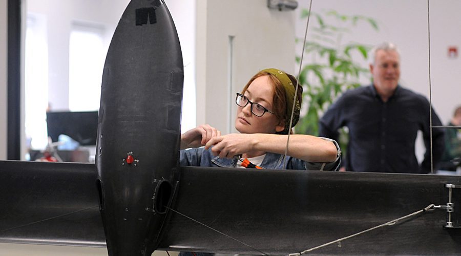 Ellie Funkhouser, test engineer with Windllift, readies a 12-foot airborne power generator for a test hover in the company's Durham test lab. Photo: Mark Courtney.