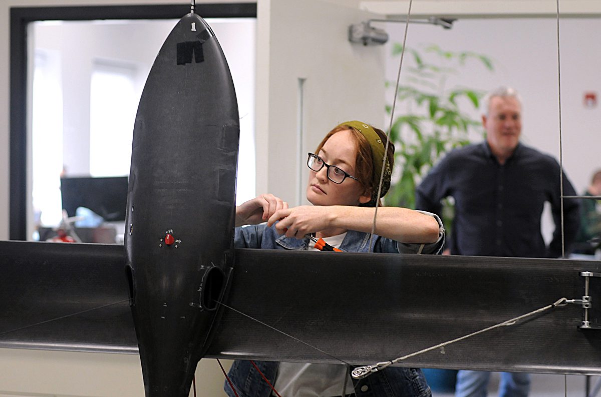 Ellie Funkhouser, test engineer with Windllift, readies a 12-foot airborne power generator for a test hover in the company's Durham test lab. Photo: Mark Courtney.