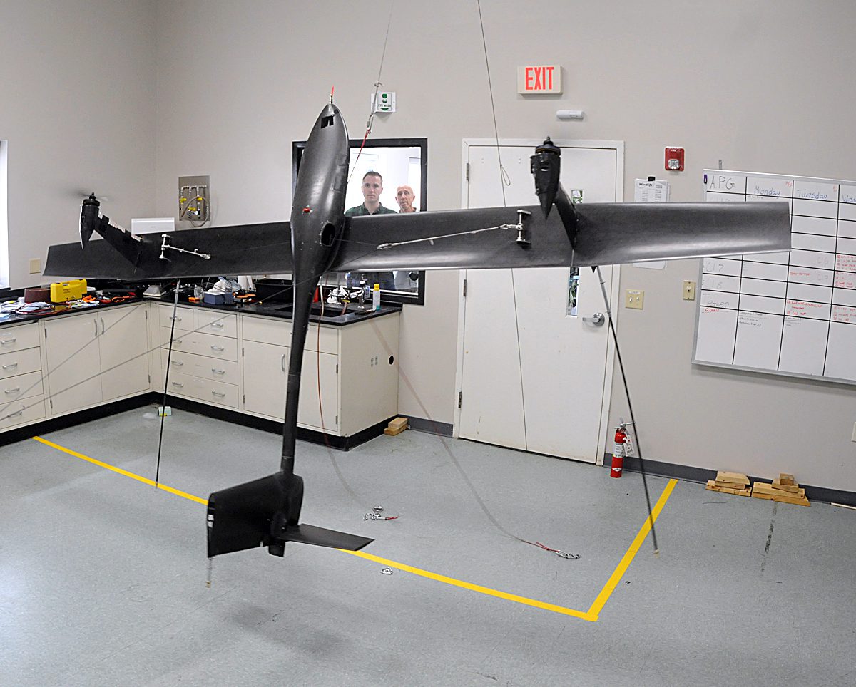 Windlift Controls Engineer Preston Tower uses a joystick to remotely perform a test hover with a 12-foot airborne power generator in the company's Durham test lab. Photo: Mark Courtney.