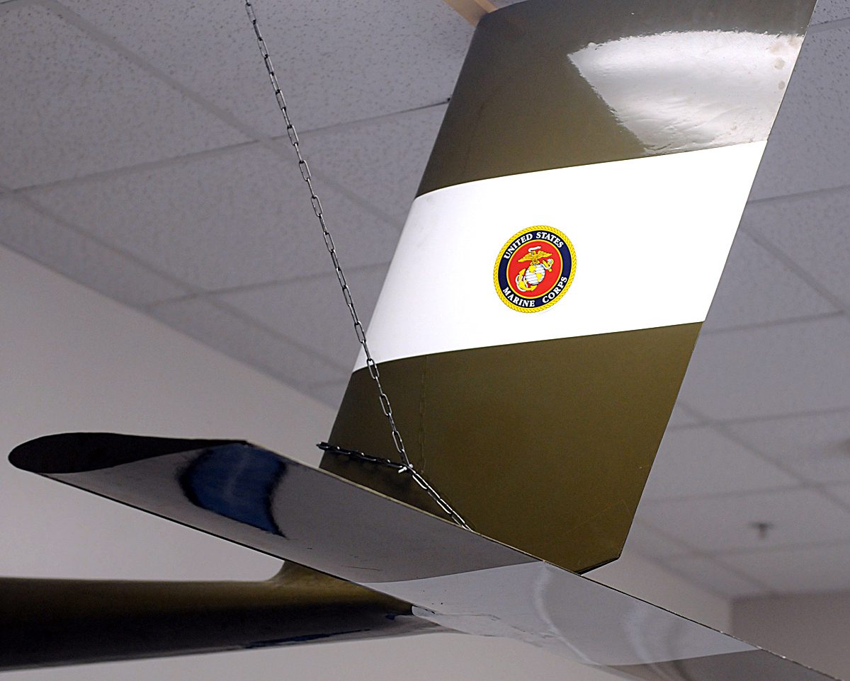 The U.S. Marine Corps Eagle, Globe, and Anchor emblem is shown on the tail of a 25-foot airborne power generator in the WIndlift office in Durham. Photo: Mark Courtney.