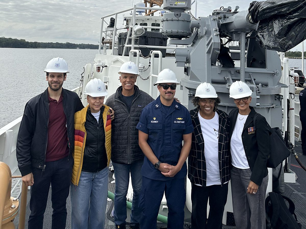 Joan Collins, second from right, and members of her family are shown onboard the deck of the U.S. Coast Guard Cutter Richard Etheridge at the Baltimore Shipyard with Lt. Zackary Kearney the vessel’s commander. From left are Patrick Jefferson, Deborah Jefferson, Marshall Collins, Lt. Kearney, Joan Collins, and Sharon Warner. Photo: Sharon Warner