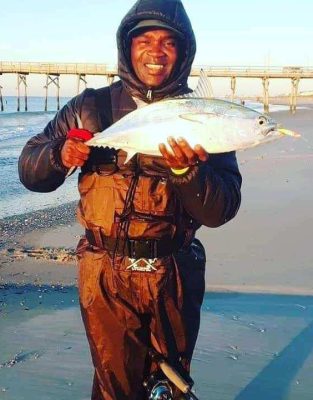 Tim Still of Havelock shows off a solid surf caught false albacore caught on one of signature lures.