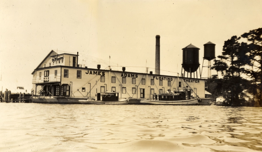 Converted from a lumber hauler in 1913, the James Adams Floating Theatre (shown here in Edenton, N.C.) traveled the towns and villages of the Chesapeake Bay and the N.C. coast for nearly 30 years. From the Francis Drane Inglis Collection, Outer Banks History Center
