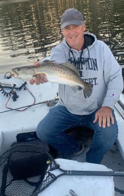 The author shows off a speckled trout he lucked into.