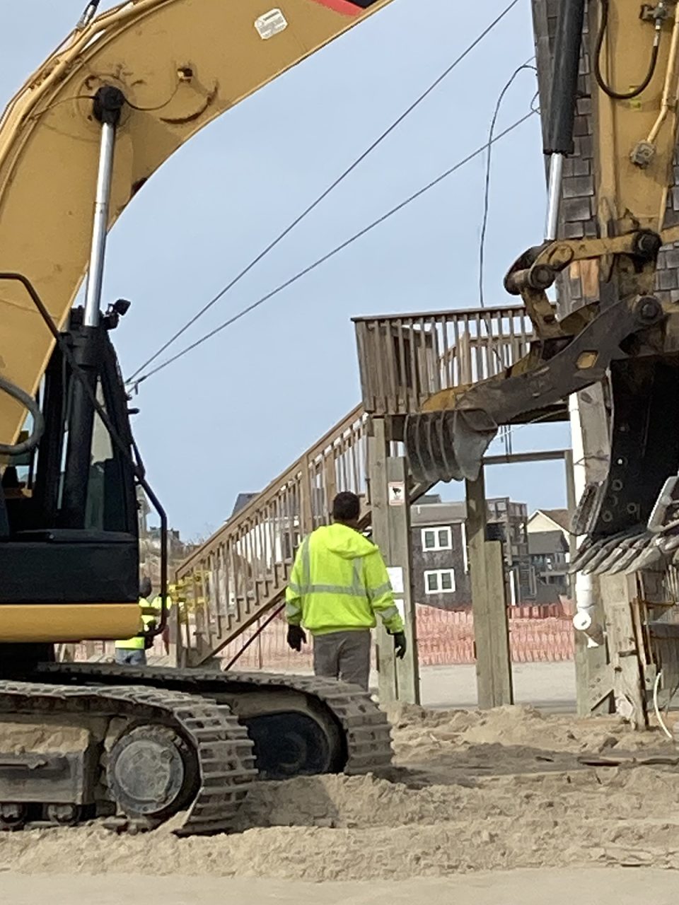 Mike Dunn, owner
of W.M. Dunn Construction of Powells Point, watches as work commences Wednesday on the demolition project on the Cape Hatteras National Seashore. Photo: Catherine Kozak