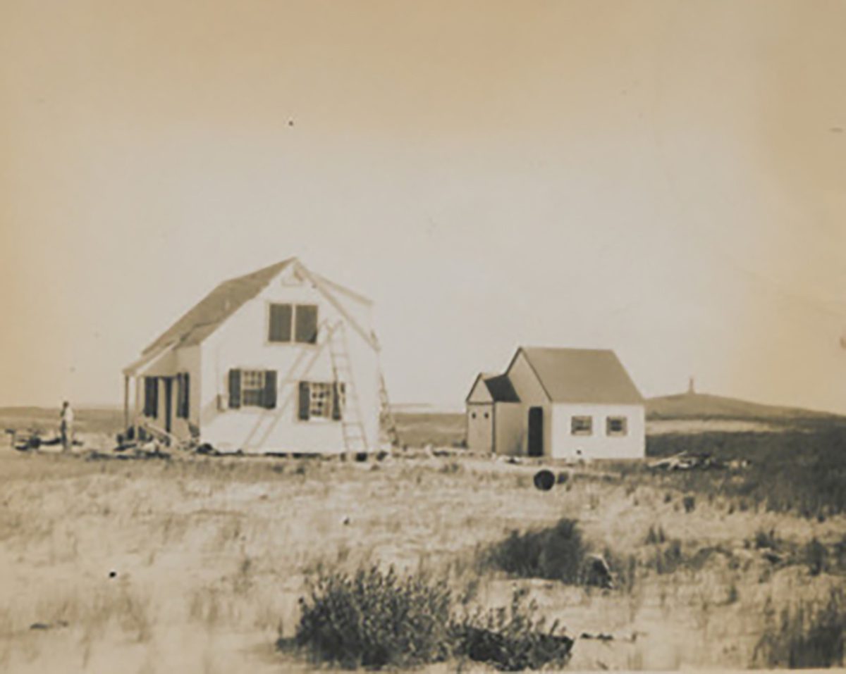 A house under construction in 1945 at Kill Devil Hills, with the Wright Brothers Memorial in the background. Photo: courtesy of the Maud Hayes Stick Collection at the Outer Banks History Center/North Carolina State Archives