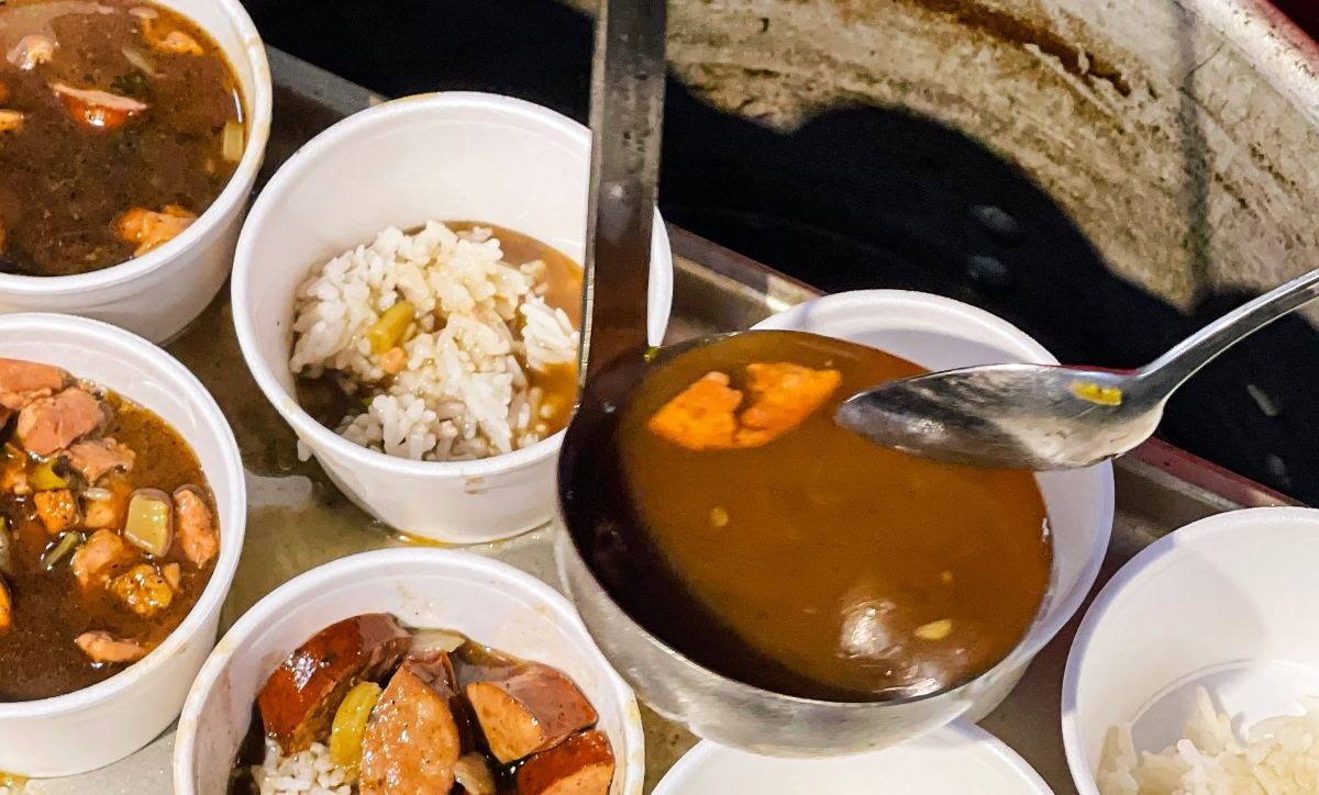 Volunteers serve gumbo during the first Core Sound Chow Down in 2022, a part of the Waterfowl Weekend at Core Sound Waterfowl Museum and Heritage Center. Photo: CSWMHC