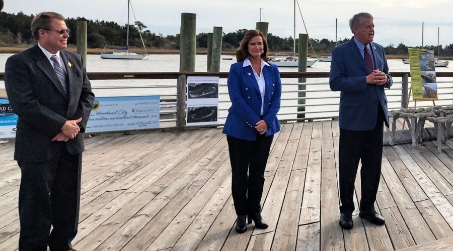 Sen. Norm Sanderson, R-Pamlico, right, who also represents Carteret County addresses Wednesday small crowd in downtown Morehead City to celebrate the start of the Sugarloaf Island restoration project as Mayor Jerry Jones, left, and Rep. Celeste C. Cairns, R-Carteret and Craven counties, look on. Photo: Jennifer Allen