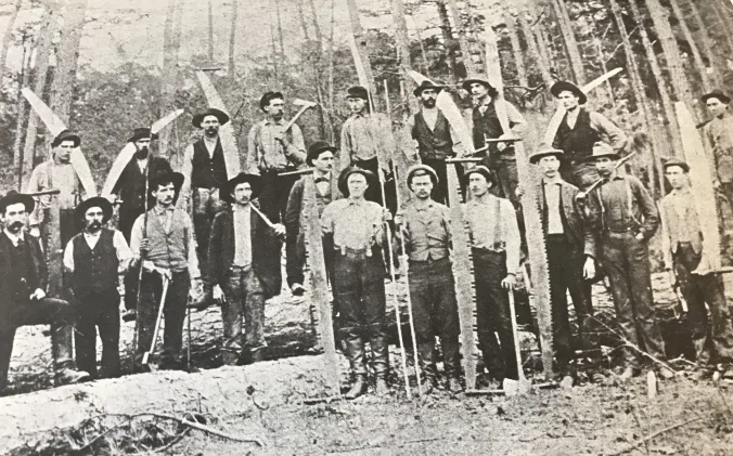 A logging crew on the western end of the East Dismal, May 1, 1897. Surry Parker is the man wearing a derby in the middle of the group. From Elizabeth Parker Roberts, Family and Friends: Pinetown, North Carolina, 1893-1918.
