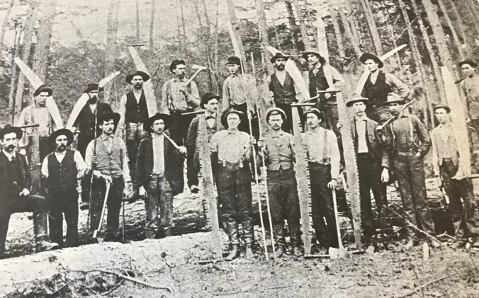 A logging crew on the western end of the East Dismal, May 1, 1897. Surry Parker is the man wearing a derby in the middle of the group. From Elizabeth Parker Roberts, Family and Friends: Pinetown, North Carolina, 1893-1918.

