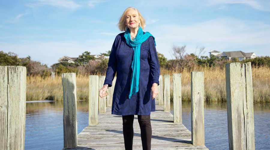 Lilias Morrison stands upon a pier at the Sanderling Racquet Club in Duck. Photo: Kip Tabb
