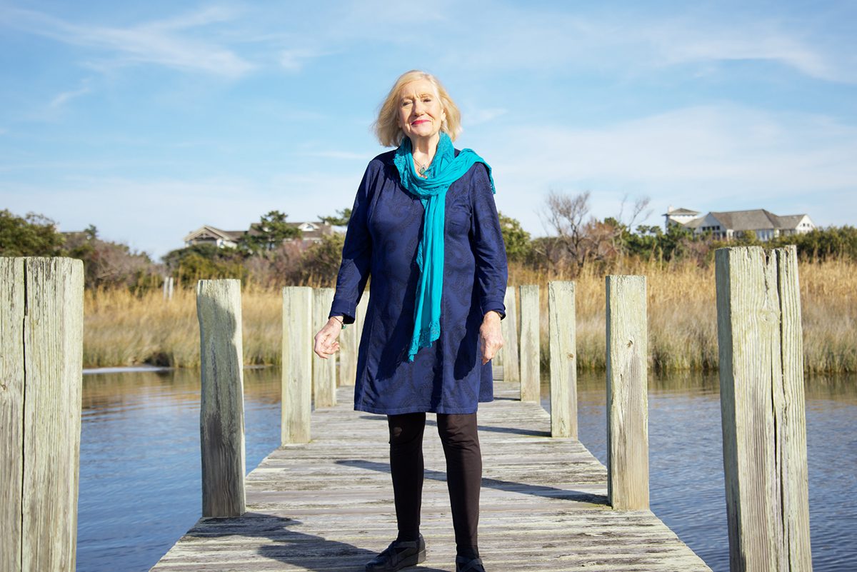 Lilias Morrison stands upon a pier at the Sanderling Racquet Club in Duck. Photo: Kip Tabb