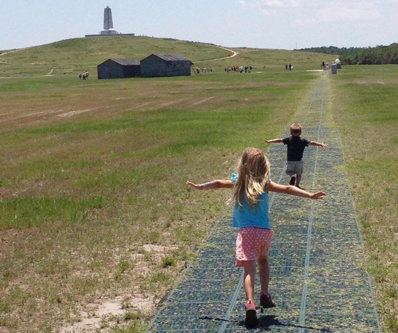 Children run along the flight line at Wright Brothers National Memorial. Photo: NPS
