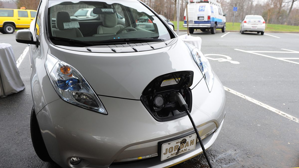 An electric vehicle is shown being charged. Photo: NCDOT