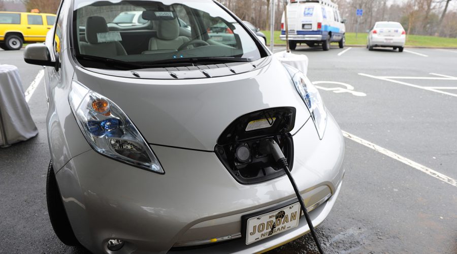 An electric vehicle is shown being charged. Photo: NCDOT