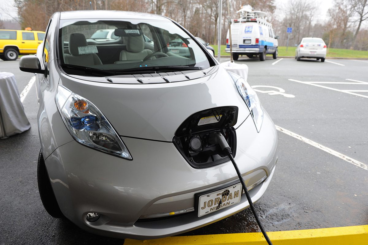 An electric vehicle is shown being charged. Photo: NCDOT