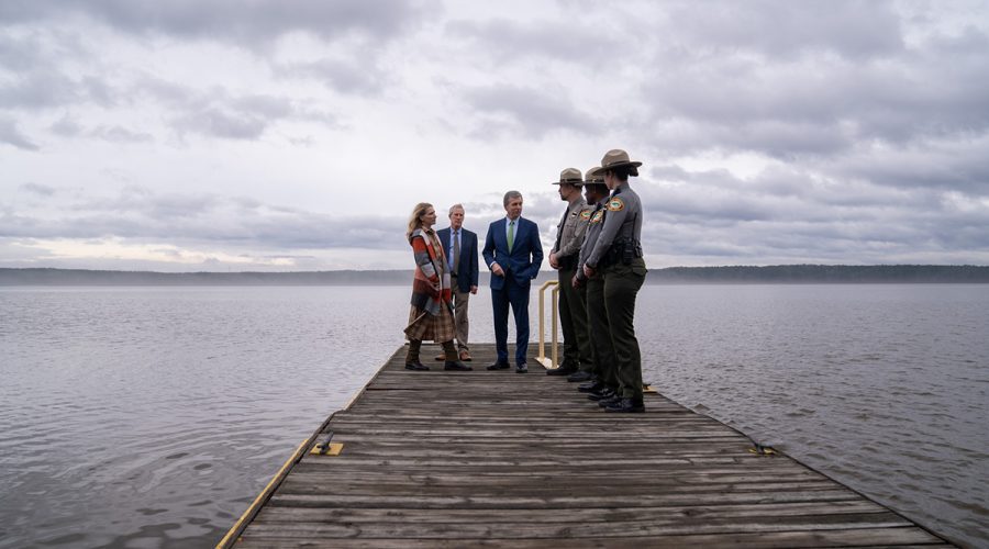 Gov. Roy Cooper, his wife Kristin and state Department of Natural and Cultural Resources Secretary Reid Wilson are shown with park rangers on a dock at the Rolling View Falls Lake Recreation Area in Durham. Photo: Governor's office