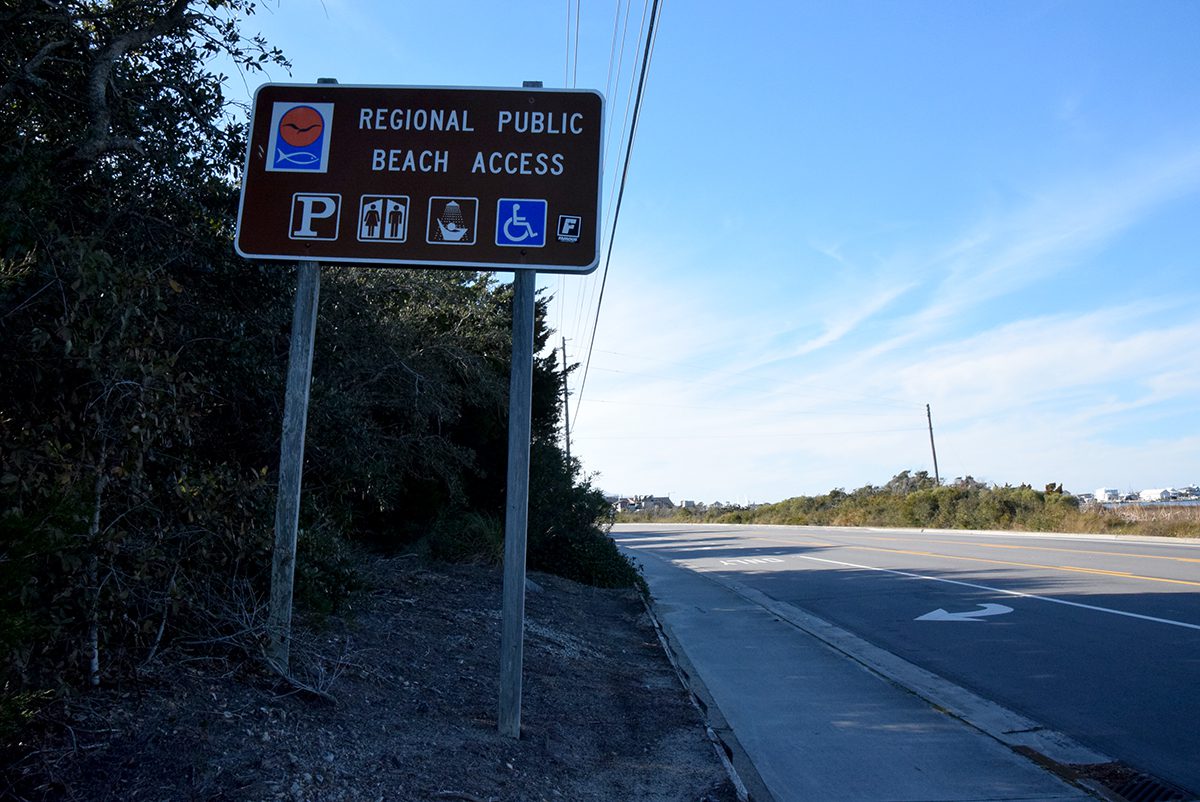 A Coastal Area Management Act regional public beach access sign shows facilities available at this site off Fort Macon Road in Atlantic Beach. Photo: Mark Hibbs