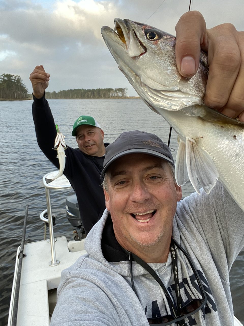 Mike Curatolo of Raleigh, left, Hall of Fame lacrosse coach at Cardinal Gibbons High School, shows off a double-header caught while with Capt. Gordon. Photo: Capt. Gordon Churchill