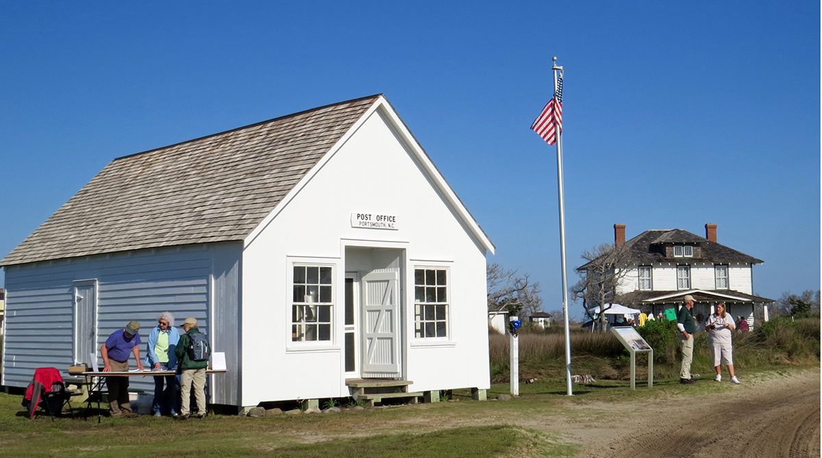 Volunteers ready the Portsmouth Village post office to open for the 2022 Homecoming. Photo: P. Vankevich/Ocracoke Observer
