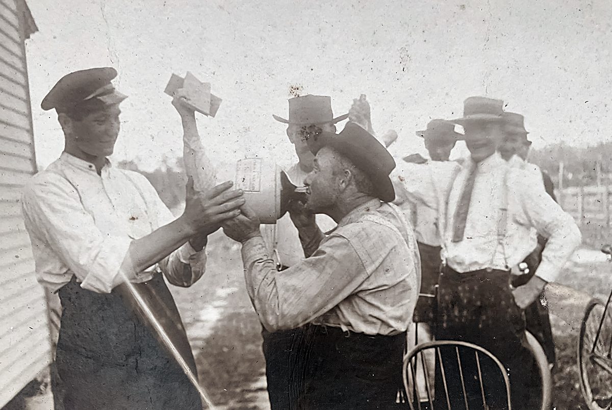 Manliff Twiford drinks from jug with, from left, Lennon Twiford, LamJack Basnight and Gold Twiford. Photo courtesy of the Dare Ancestry Facebook page, used with permission.