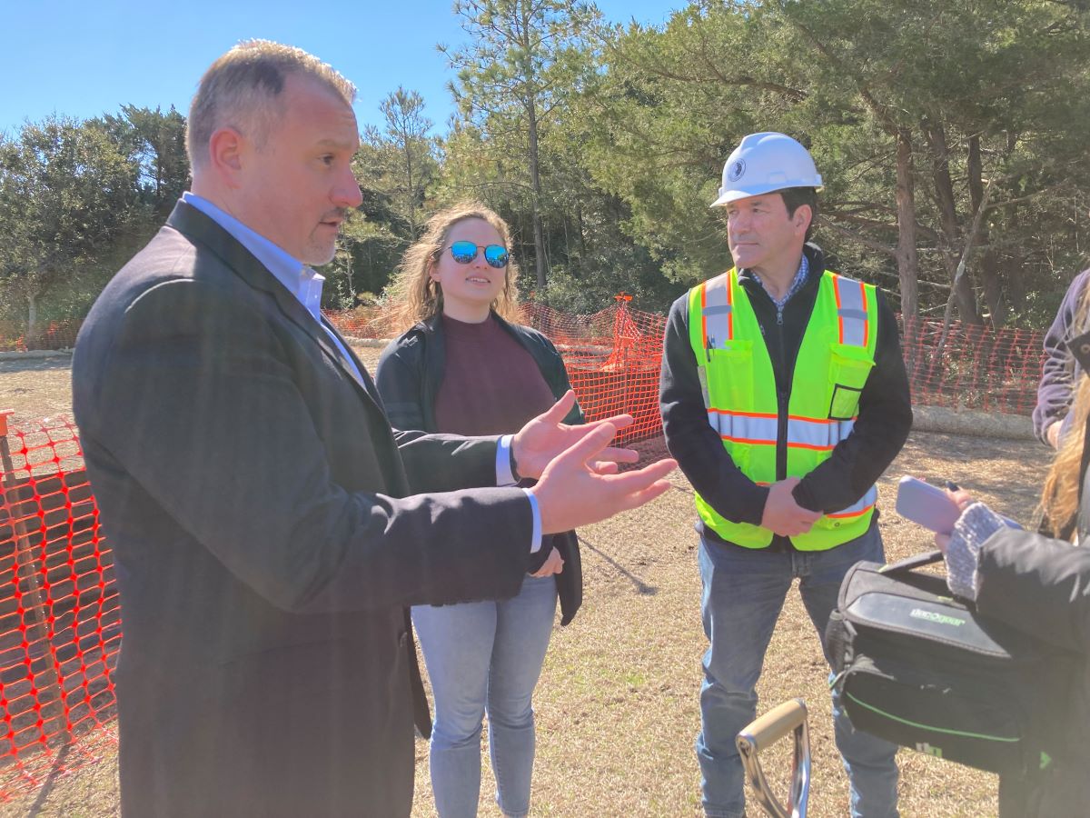 Stone & Lime Masonry Restoration's Vice President Chris Dabek, left, speaks to the media Feb. 14 during the ceremonial groundbreaking as Lindsey Gravel, site quality control, center, and Ed Milch, general superintendent, look on. Photo: Catherine Kozak