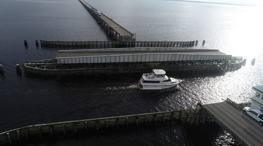 The Lindsay C. Warren Bridge over the Alligator River swings open for a pleasure craft. Photo: NCDOT