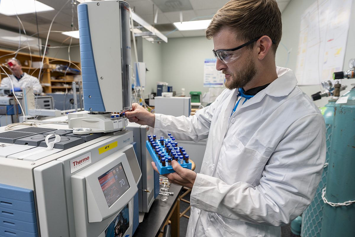 Cody Wilson, an undergraduate marine science student at UNCW works in Ralph Mead's PFAS Science laboratory to advance PFAS understanding. Photo: Jeff Janowski/UNCW