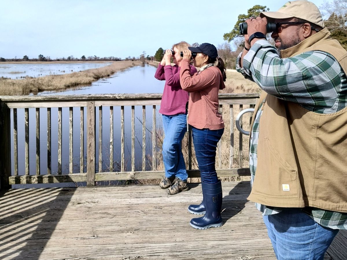 Participants learn about waterfowl at Lake Mattamuskeet in February during a past ForestHer NC birding event. Photo: ForestHer NC