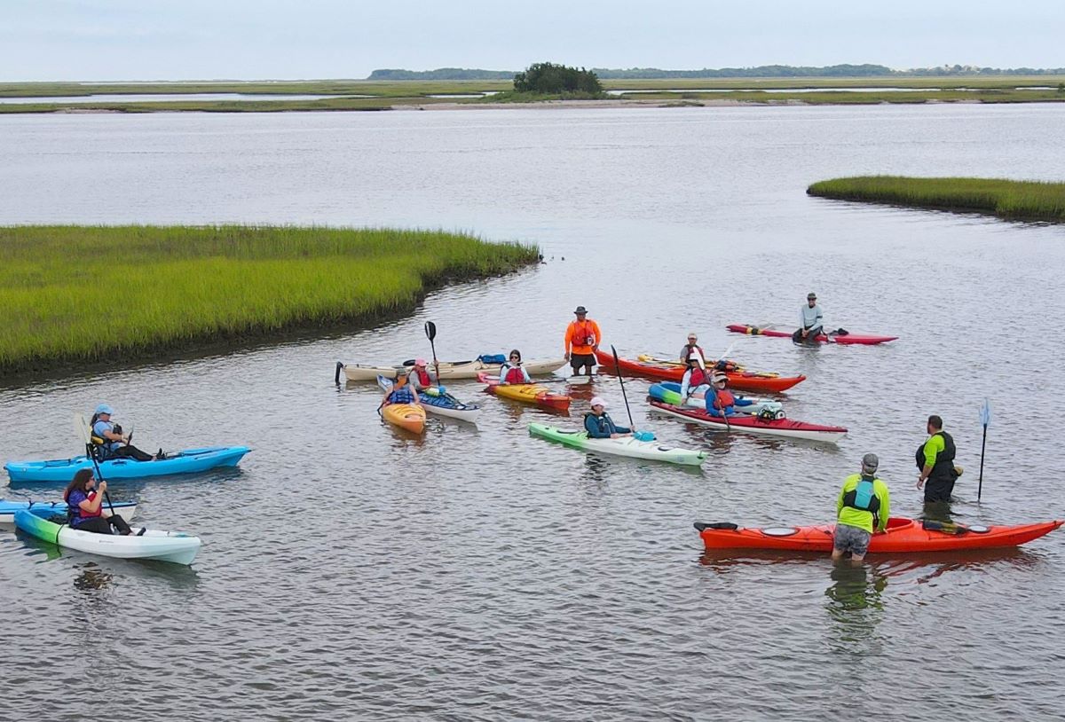 The group pauses for a photo during the first "Kayaking 101" class offered at Hammocks Beach State Park. Photo courtesy American Canoe Association/NC State Parks