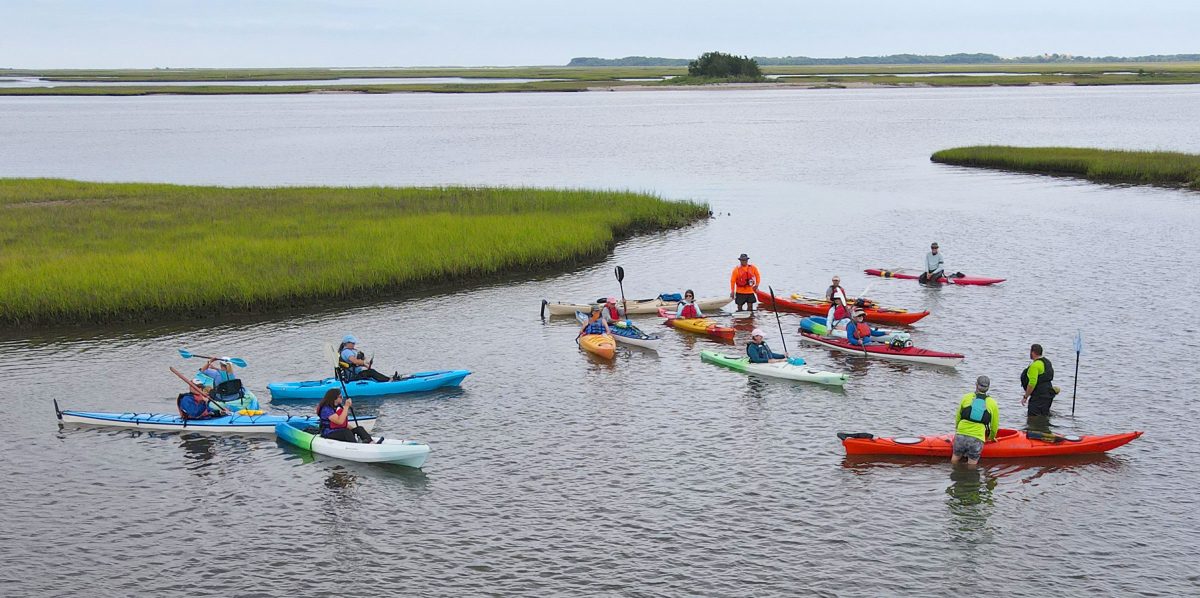 The group pauses for a photo during the first "Kayaking 101" class offered at Hammocks Beach State Park. Photo courtesy American Canoe Association/NC State Parks