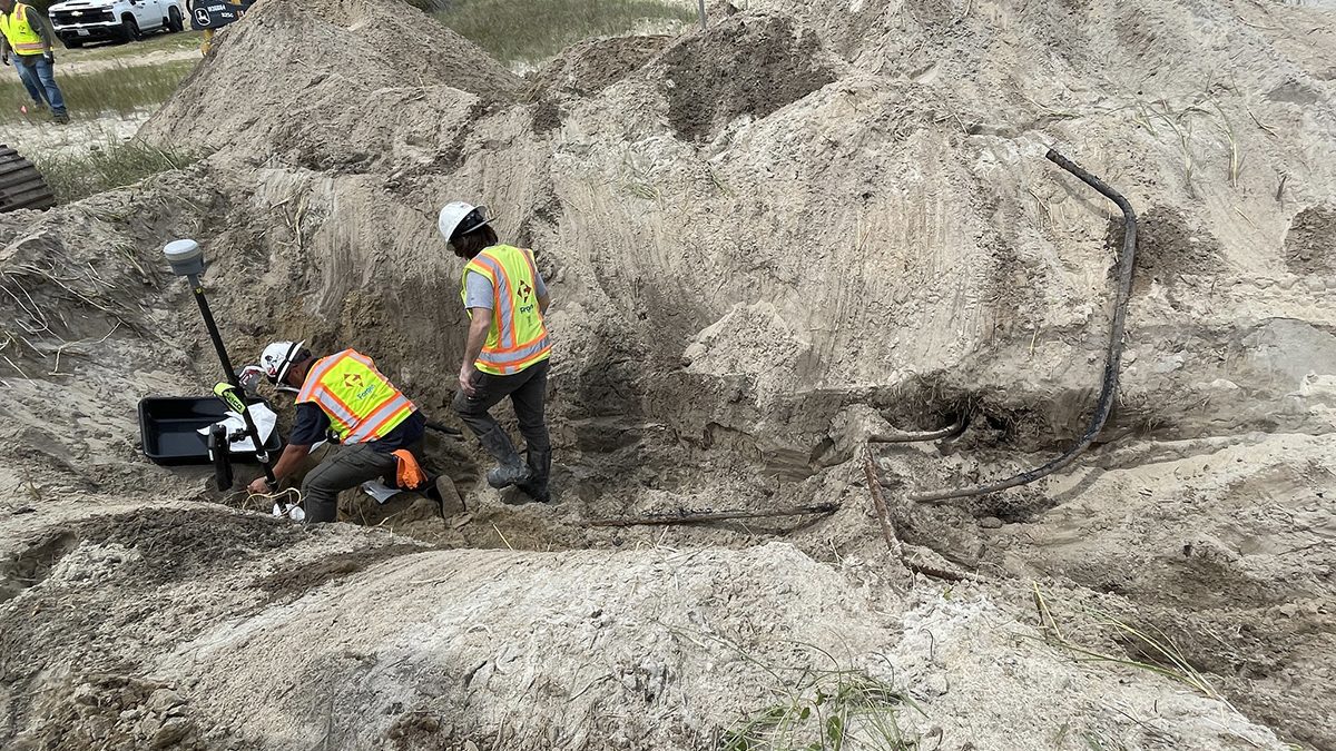 An Army Corps of Engineers crew removes pipe and tests soil Monday at the Buxton Beach Access. Photo: Cape Hatteras National Seashore