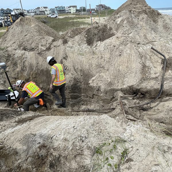 An Army Corps of Engineers crew removes pipe and tests soil Monday at the Buxton Beach Access. Photo: Cape Hatteras National Seashore