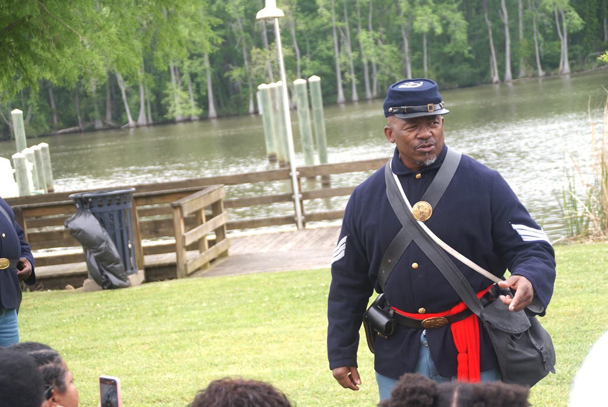 Curtis Jenkins of the 35th U.S. Reenactors Colored Troops at the commemoration of the Plymouth Massacre. Along with the 2nd Regiment, U.S. Colored Light Infantry, Battery B, the 35th set up an encampment next to the Roanoke River so that visitors could learn more about the approximately 200,000 black soldiers and sailors who served in the Civil War. Photo: Sharon C. Bryant