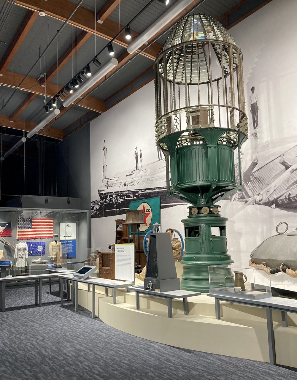 A Fresnel lens looms large over this exhibit space at the Graveyard of the Atlantic Museum. Photo: Catherine Kozak
