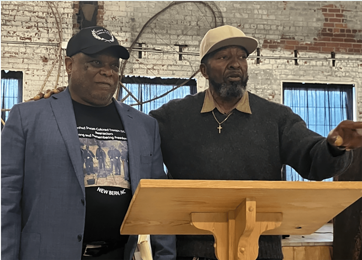 Local poet and griot Ronald Brooks, right, also shared two very powerful poems with the audience. In this photo, Mr. Brooks is standing with James Williams -– we could all tell that they had been friends since elementary school. Photo: David Cecelski
