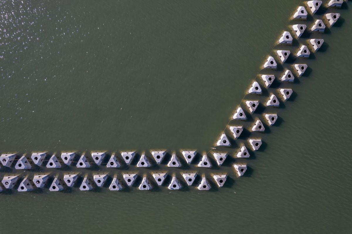 A closeup overhead view of wave attenuators in place around the west side of Sugarloaf Island. Photo: Dylan Ray