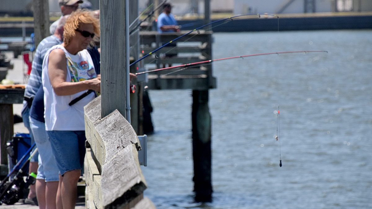 Recreational fishers cast from the Newport River Pier on Radio Island Tuesday in Morehead City. Photo: Mark Hibbs