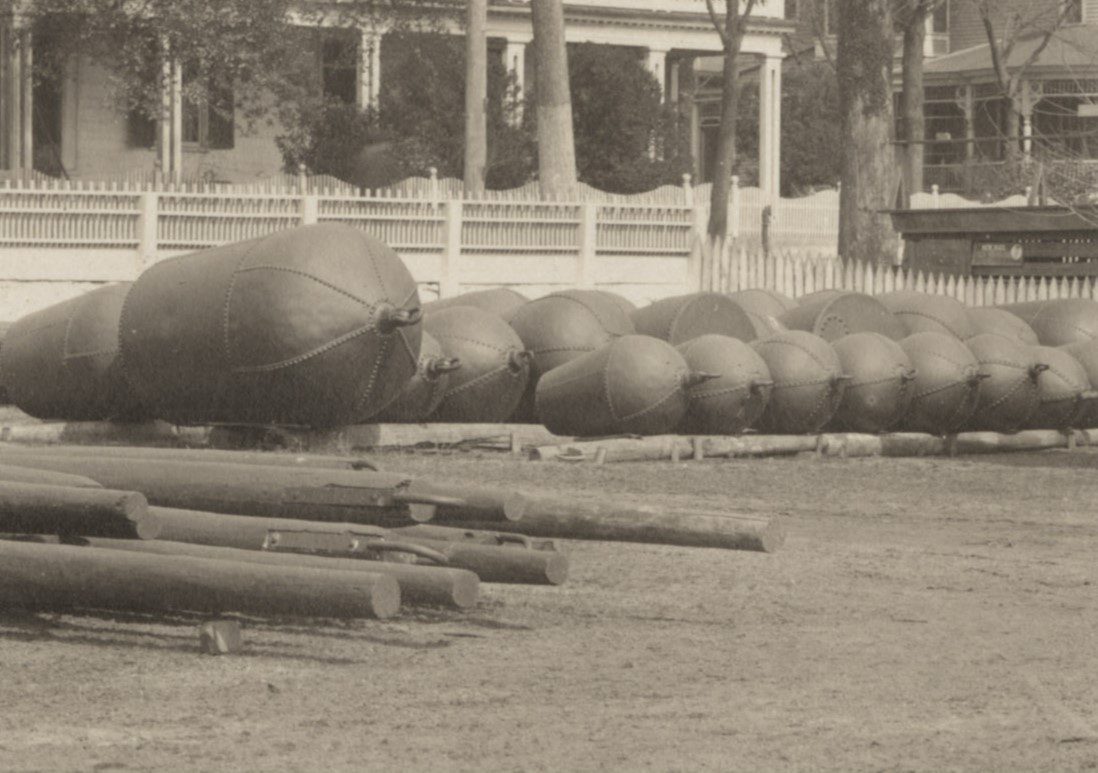 Close-up of can buoys and beacon posts at the U.S. Lighthouse Service’s buoy depot in Washington, N.C., March 1914. Photo: Records of the U.S. Coast Guard (RG 26), NA-College Park (#45694877)