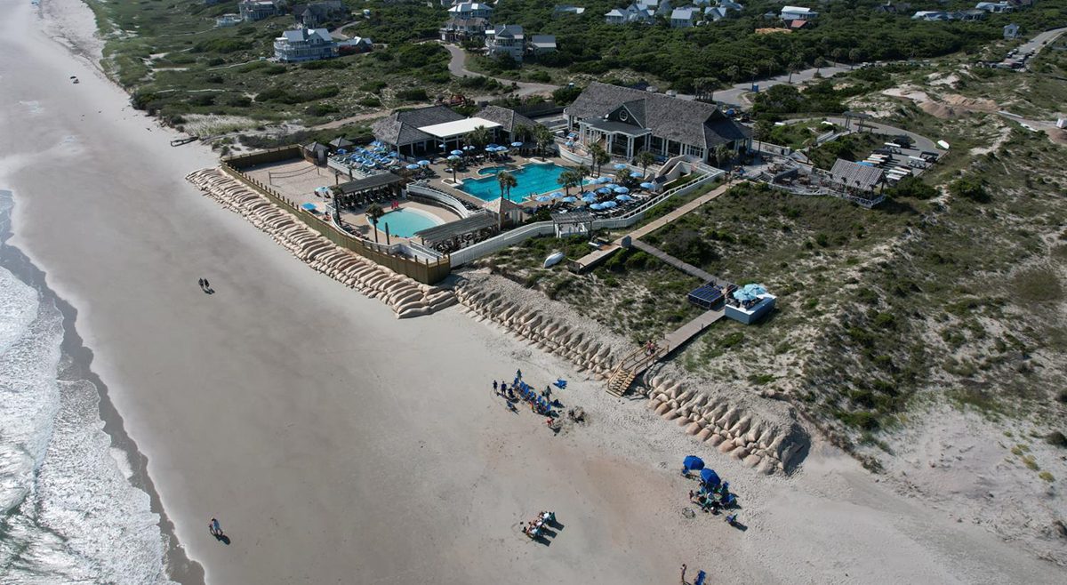 This Bald Head Island drone image from June 17, 2022, shows The Shoals Club and the sandbag revetment on the beachfront.