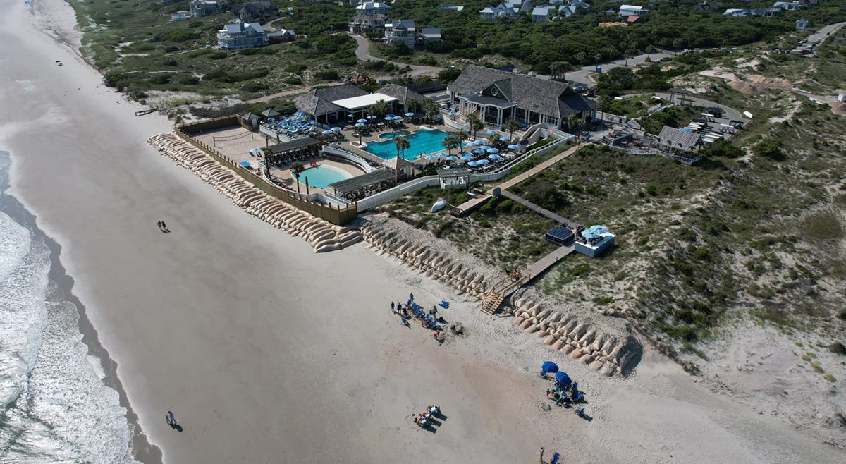 This Bald Head Island drone image from June 17, 2022, shows The Shoals Club and the sandbag revetment on the beachfront. 