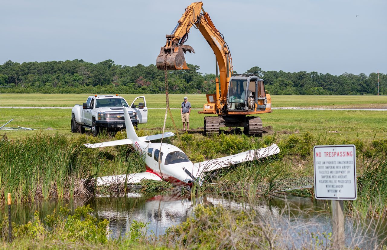 A private plane rests in a drainage ditch Sunday morning after leaving the runway Saturday evening at Michael J. Smith Field in Beaufort. Photo: Dylan Ray