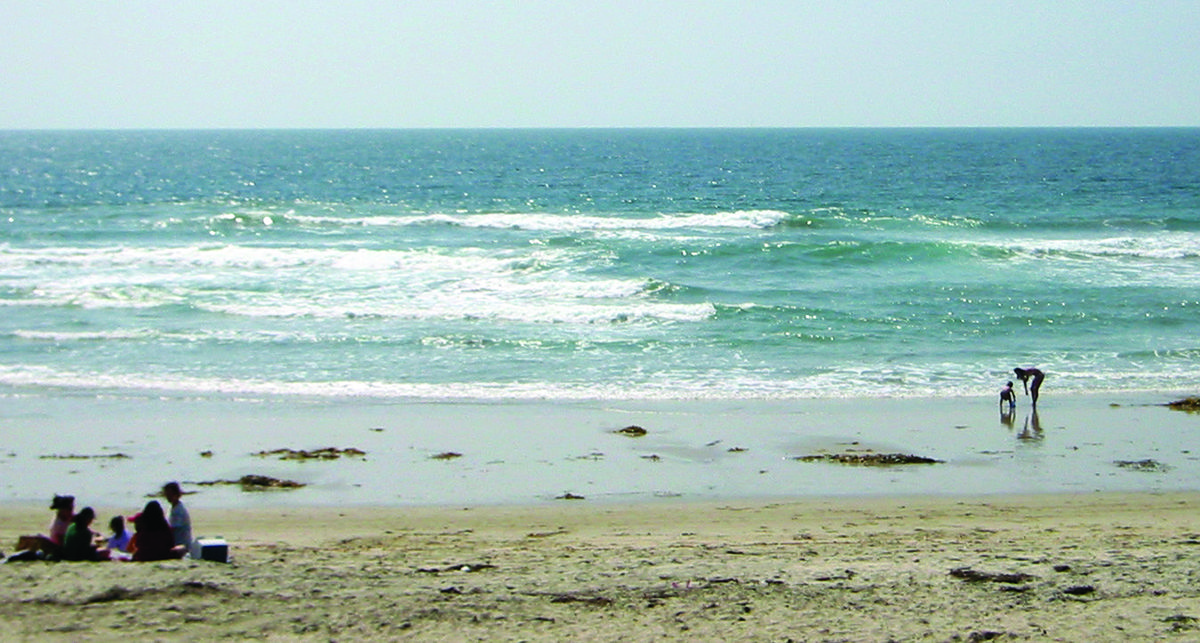 This National Weather Service photo shows a narrow, darker gap between areas of breaking waves, noting that can signal a rip current location.