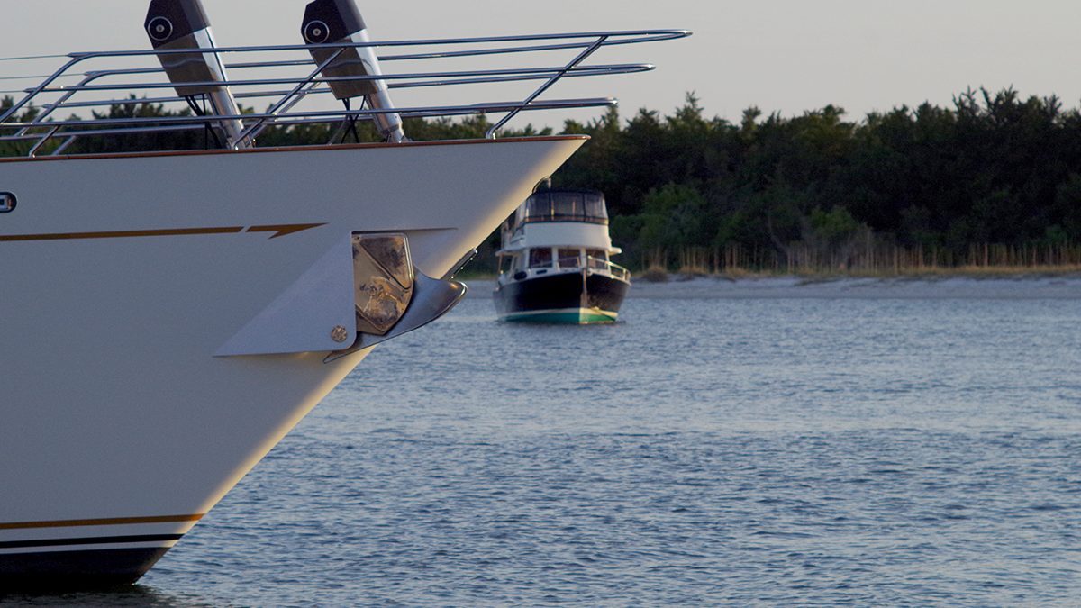 A vessel docked at the Beaufort waterfront is shown in the foreground with another vessel just beyond is moored in Taylors Creek in this April photo: Photo: Mark Hibbs