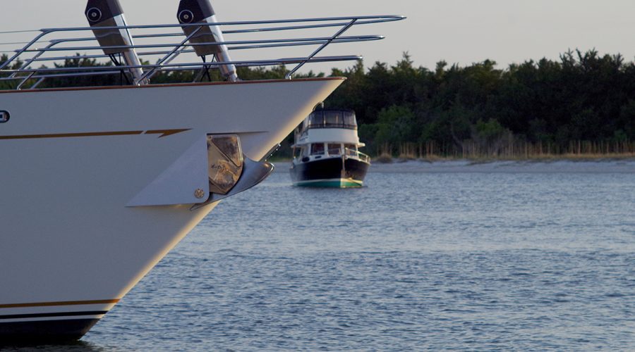 A vessel docked at the Beaufort waterfront is shown in the foreground with another vessel just beyond is moored in Taylors Creek in this April photo: Photo: Mark Hibbs